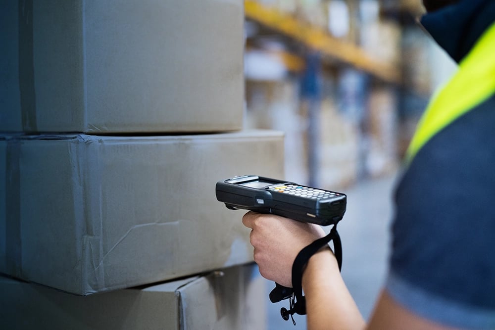 Worker scanning boxes