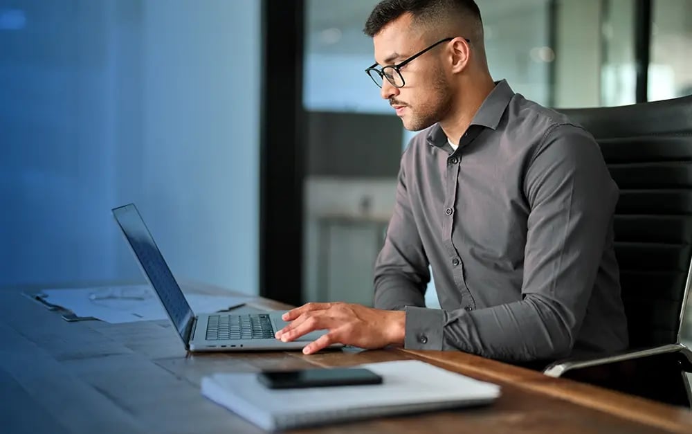 Operations Manager working on laptop